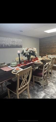 a dining room with a long table and chairs at Boone Trace Inn Room 7 in Pineville