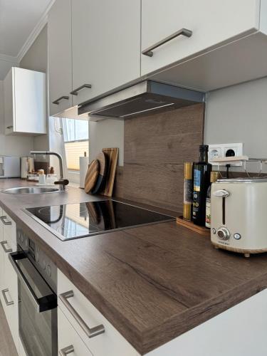 a kitchen with a counter top with aounter at Aesthetic Cozy Home Lüdenscheid in Lüdenscheid