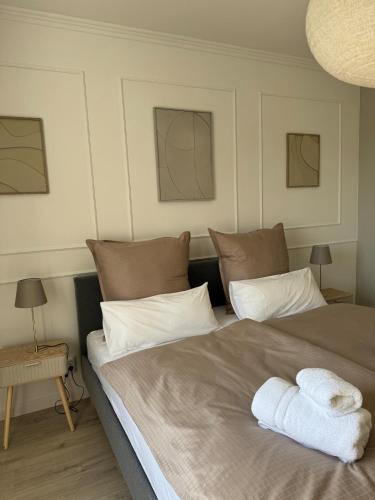 a bedroom with a bed with towels on it at Aesthetic Cozy Home Lüdenscheid in Lüdenscheid
