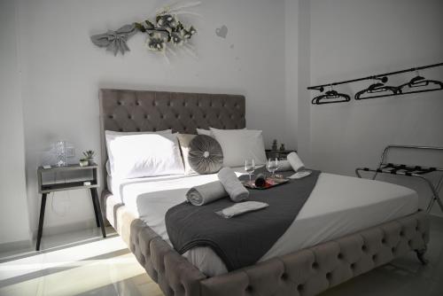 a bedroom with a large bed with a table on it at Villa Irene in Heraklio Town