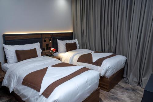 Ένα ή περισσότερα κρεβάτια σε δωμάτιο στο Samama Ajyad Hotel Makkah