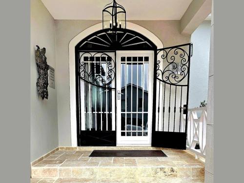 a black and white gate in a house at Fleur du Soleil Luxury Guesthouse in Franschhoek