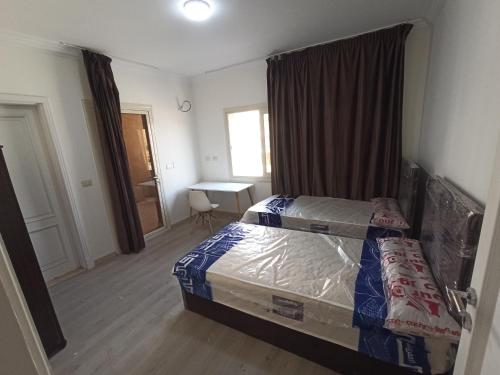 غرف فندقية بجوار الجامعةالاوربية و الكندية والالمانية بكمبوند المقصد العاصمة الادارية