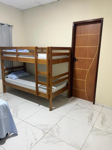 Postel nebo postele na pokoji v ubytování Pitimbu Beach House