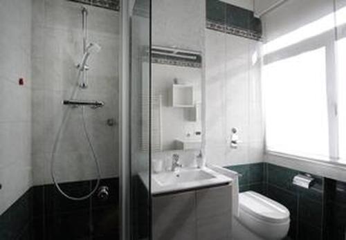 a bathroom with a shower and a sink and a toilet at "Suite Sempione Park" 2 bedrooms - 2 bathrooms in Milan