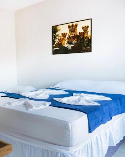 Cama o camas de una habitación en POUSADA e HOSTEL ARAUNA