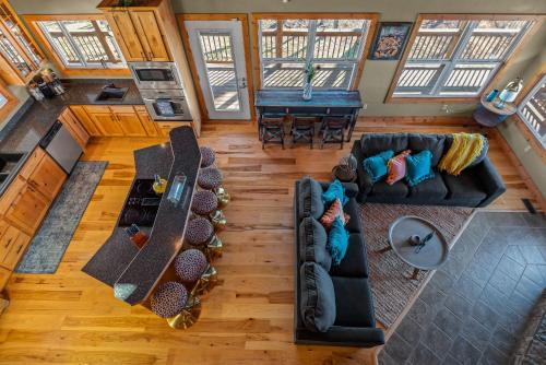 an overhead view of a living room with couches at Ozark Retreat with Mountain Views Fire Pit & Deck in Parthenon