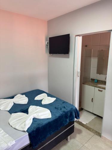 Cama o camas de una habitación en POUSADA e HOSTEL ARAUNA
