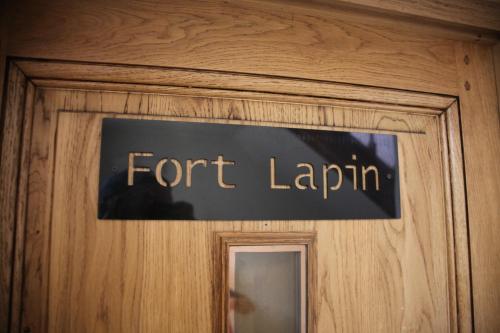 a sign on a door that reads fort layin at Hotel Salvators in Bruges