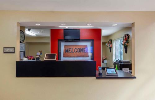 a lobby with a reception desk with a welcome sign at Extended Stay America Suites - Raleigh - North Raleigh - Wake Towne Dr in Raleigh