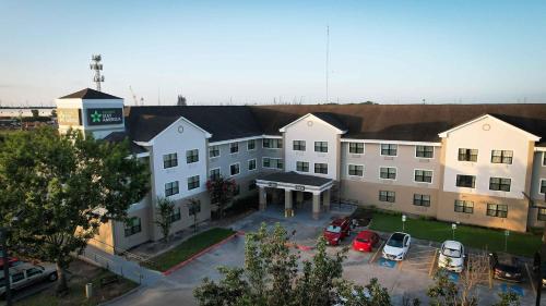 an aerial view of a hotel with cars parked in a parking lot at Extended Stay America Suites - Houston - Willowbrook - HWY 249 in Houston