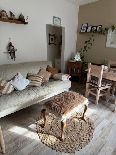 a living room with a couch and a table at Arenas blancas 2024 in San Clemente del Tuyú