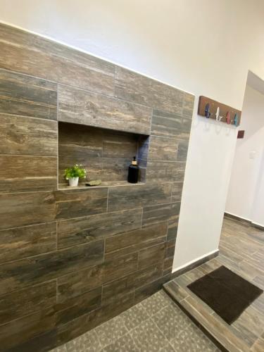 a room with a stone wall with a fireplace at Casa Loto D in Chelem