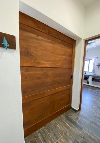 a wooden garage door in a living room at Casa Loto D in Chelem