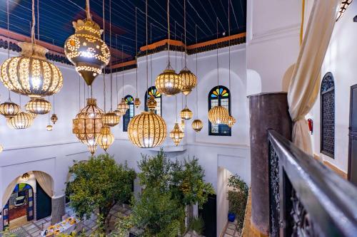 a building with many lights hanging from the ceilings at Riad Dar Dialkoum in Marrakech