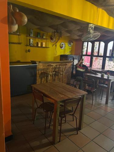 a person sitting at a table in a restaurant at Hostal Valle in Valledupar