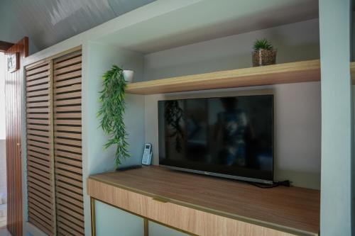 TV a/nebo společenská místnost v ubytování Gruta das estrelas Restaurante e suítes