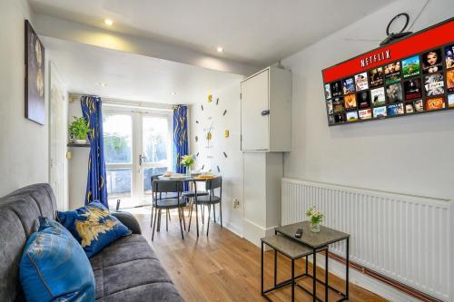 a living room with a couch and a table at H17B Cosy & Welcoming house & Private parking in Liversedge