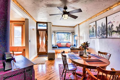 a living room with a table and a ceiling fan at Rustic & Cozy 1BR one block from Main Street in Leadville
