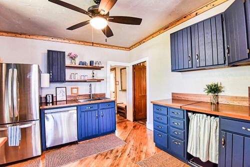 a kitchen with blue cabinets and a ceiling fan at Rustic & Cozy 1BR one block from Main Street in Leadville