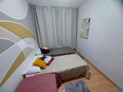 Una cama o camas en una habitación de Casa Completa Aconchegante e Decorada