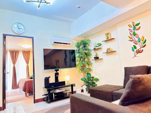AdahkuMaya Luxury Suitesにあるテレビまたはエンターテインメントセンター