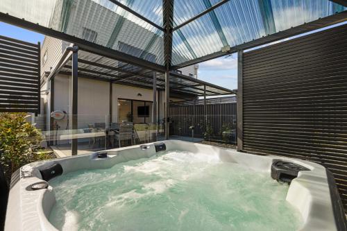 a jacuzzi tub in the middle of a house at San Remo Luxe 2 in San Remo
