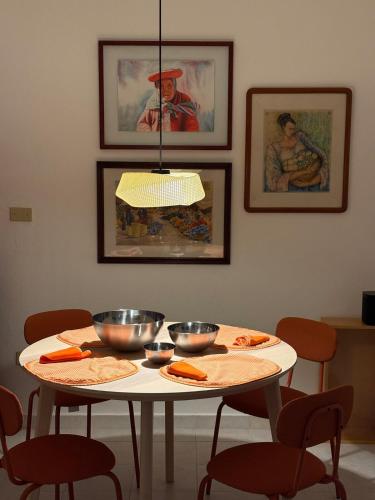 a white table with two bowls on top of it at Fun House Tampiquito in Monterrey