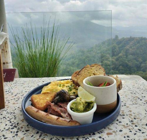 a blue plate of food on a table at Batur Sunrise Camp in Kintamani
