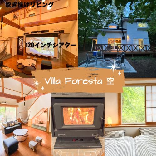a living room with a tv and a fireplace at Villa Foresta Sora in Nasushiobara
