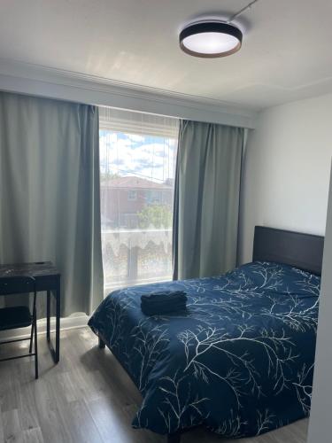 a bedroom with a bed and a window at Toronto Full Bed in a Room - Midtown in Toronto