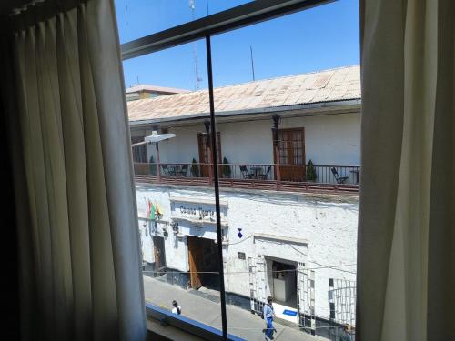 a view of a building from a window at Hostal Europa in Arequipa