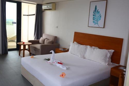 Postel nebo postele na pokoji v ubytování Nalagi Hotel
