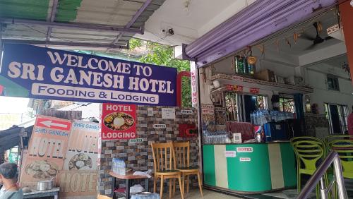 a store with a sign for a sri ganesha hotel at SRI Ganesh Hotel Fooding & Lodging in Bongaigaon