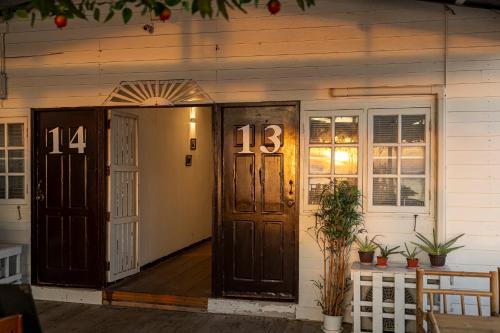 a front door of a house with numbers on it at Karoon Sea View Lodge in Hua Hin