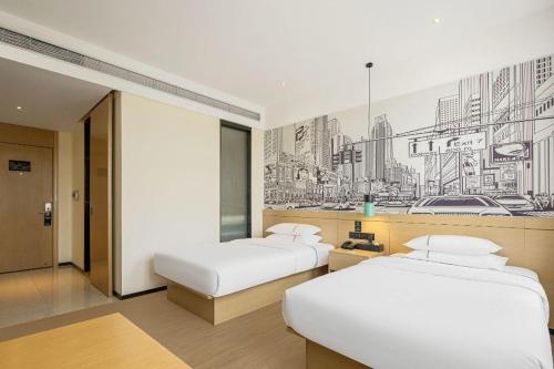 Postel nebo postele na pokoji v ubytování City Comfort Inn Yichang Zigui Three Gorges Dam Binhu