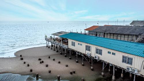 an aerial view of a pier next to the water at Karoon Sea View Lodge in Hua Hin