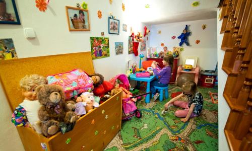 a group of children playing in a room with toys at Penzión Šafrán in Ždiar