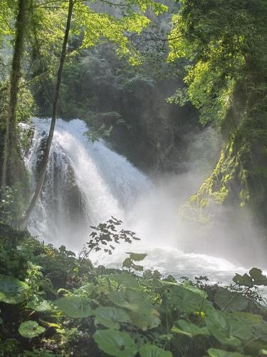 a waterfall in the middle of a river at A casa di Irene in Le Marmore