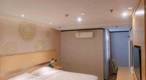 a small bedroom with a bed and a window at GreenTree Inn Beijing Shunyi Fengbo Metro Station in Beijing