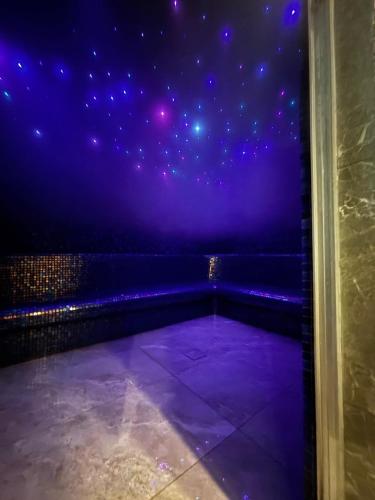 a room with a purple sky with stars at Panorama Tornik S3 in Zlatibor