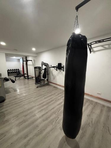 a gym with a punching bag hanging from the ceiling at Panorama Tornik S3 in Zlatibor