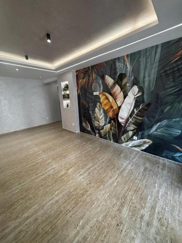 an empty room with a large painting on the wall at Panorama Tornik S3 in Zlatibor