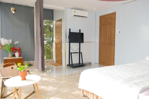 Ένα ή περισσότερα κρεβάτια σε δωμάτιο στο Sunny 1 Hometel Vinh Long