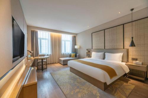 Μια τηλεόραση ή/και κέντρο ψυχαγωγίας στο Echarm Hotel Jinan Railway Station Daming Lake