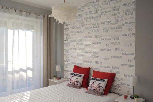 a bedroom with a wall with writing on it at Apartament Kabaty in Warsaw