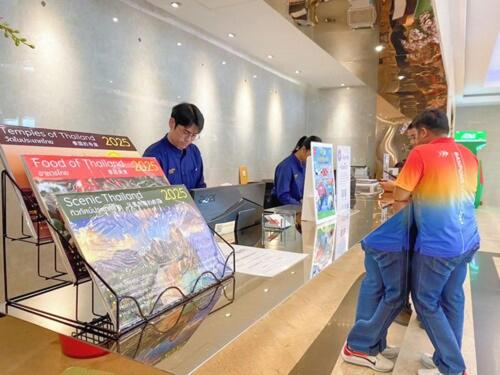 a group of people standing at a counter in a store at Avana Residence in Bangna