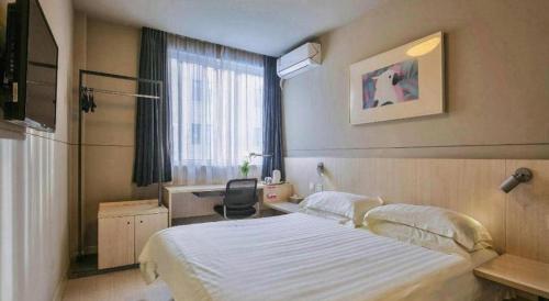 Cama o camas de una habitación en Jinjiang Inn Taizhou Huangyan Jiufeng Park