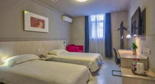 Cama o camas de una habitación en Jinjiang Inn Taizhou Huangyan Jiufeng Park