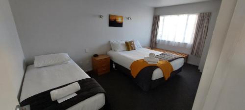 Postel nebo postele na pokoji v ubytování Fitzherbert Court Motel